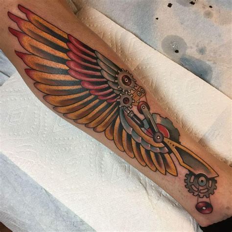 hermes wings calf tattoo.